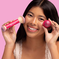 Tween girl holding Plume brush and Bonbon Cheeks in Poppy