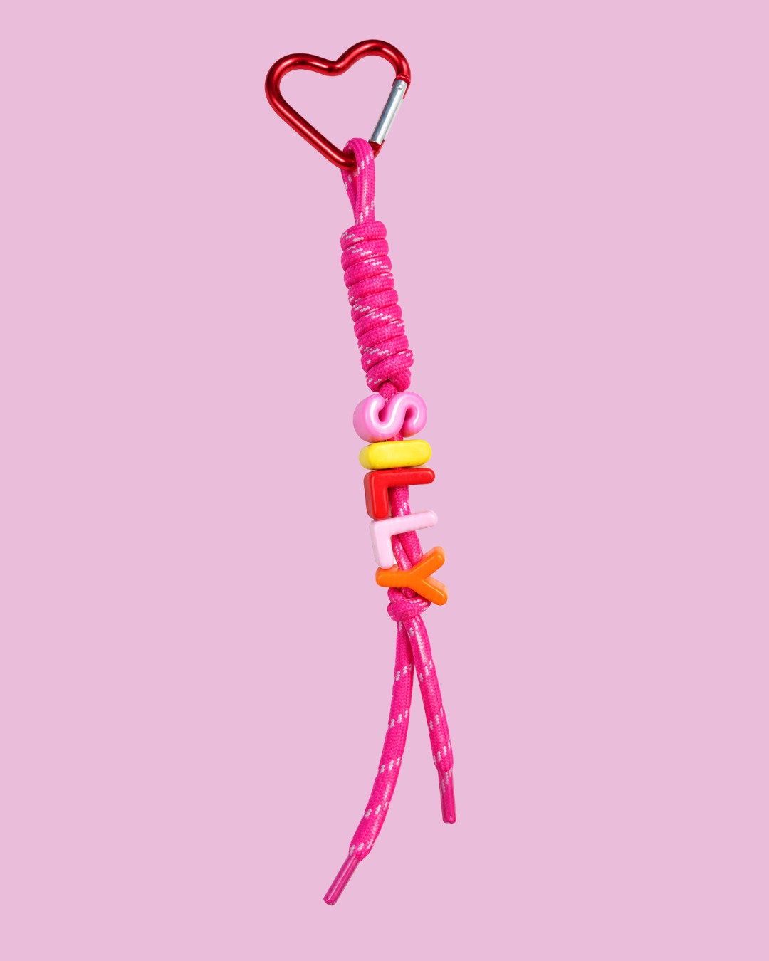 Silly Unicorn Keychain with red heart carabiner on pink background